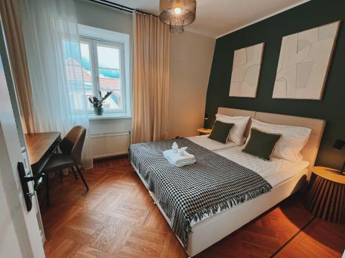 a bedroom with a bed with a stuffed animal on it at Space - Style - Prime location - Old Town views in Tallinn
