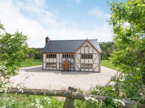 a large white house with a black roof at 4 Bed in Chirk 87675 in Chirk