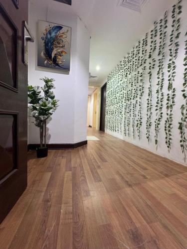 a hallway with a wall with writing on it at Capital View in Abu Dhabi