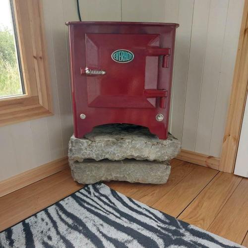 a red machine in a corner of a room at Doris in Wedmore
