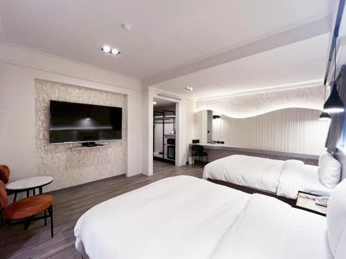 Postel nebo postele na pokoji v ubytování Dolamanco Hotel