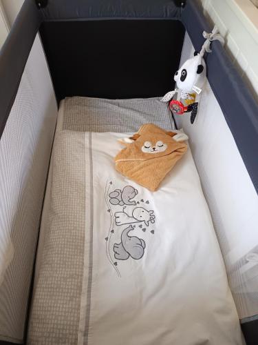a bed with a hello kitty comforter in a car at Apartmán 29 LANOVKA in Jáchymov
