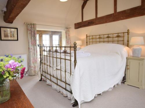 a bedroom with a large bed in a room at 3 Bed in Langport 75576 in Curry Rivel