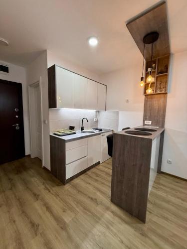 a kitchen with a sink and a counter top at Royal Apartmani 1 in Paraćin
