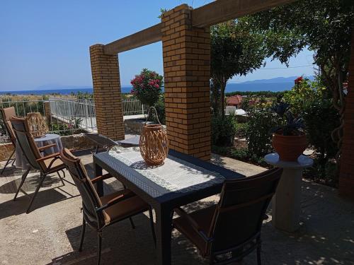 a blue table and chairs on a patio at Blue Paradise Villa in Karianí