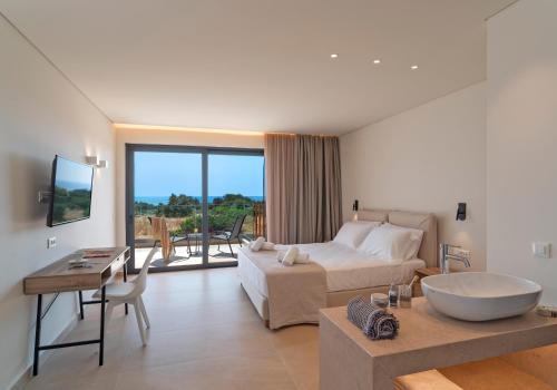 TV a/nebo společenská místnost v ubytování Aethrion Villas & Suites
