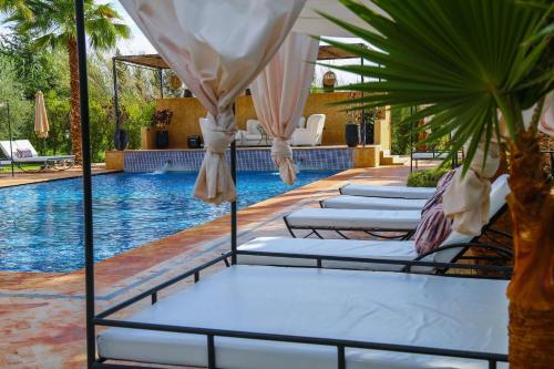 Swimmingpoolen hos eller tæt på Villa Palmyra, 8 suites et piscine chauffée