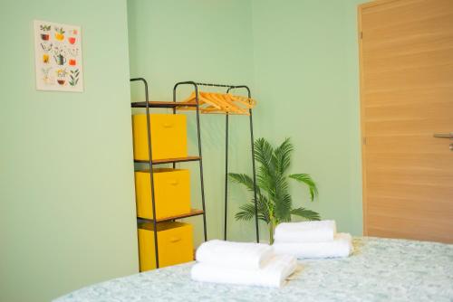 a room with a bed with yellow drawers at Parking gratuit à 3 min à pied, Clim, Laverie, Fibre, proche de Rousset, zone d'activités et domaines pour Mariages in Trets