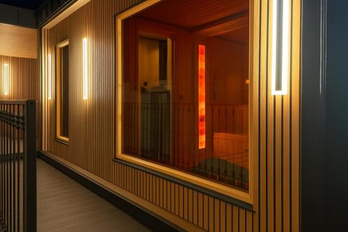 a room with a window and a balcony at Willa Zdrojowa PARK Sauna, Jacuzzi, Fitness in Busko-Zdrój