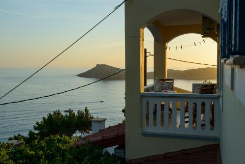 a balcony of a building with a view of the ocean at Melina's Sunset in Myrties