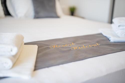 a table with a brown napkin with the words happy birthday at Poolside Hideout Apartments in Novalja