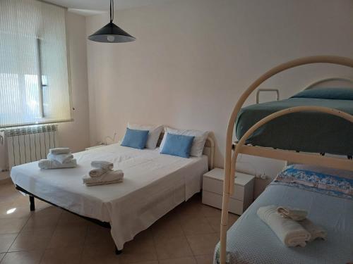 a bedroom with two beds and a bunk bed at Nonna Eleonora in Otranto