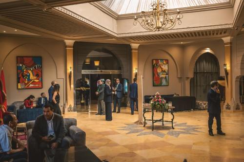 a group of people standing in a lobby at RS Hotel Karam Palace in Ouarzazate