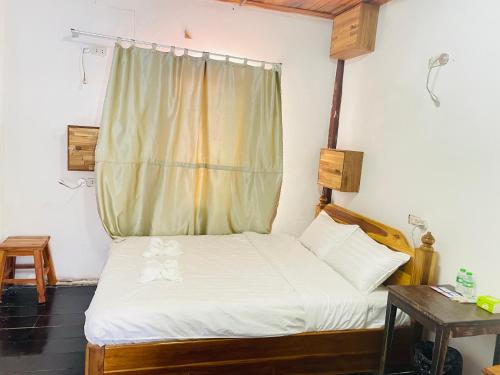 Llit o llits en una habitació de Maem GUESTHOUSE