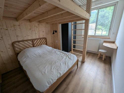 En eller flere senger på et rom på Appartement - Plume