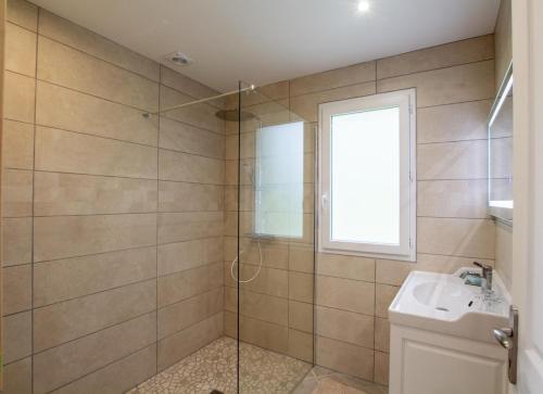 a bathroom with a shower and a sink at La belle etoile in Saint-Aulaye