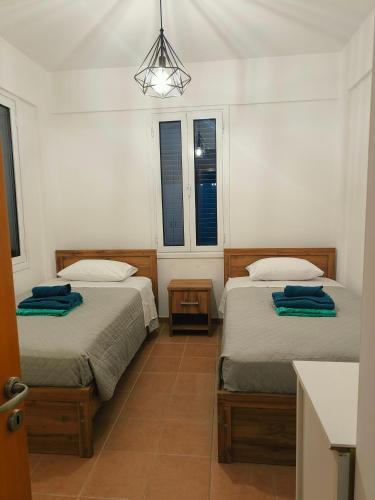 Ένα ή περισσότερα κρεβάτια σε δωμάτιο στο Possidon Beach Getaway