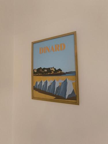 a picture hanging on a wall in a room at L'Echappée Urbaine - 2 personne proche - centre ville in Saint-Brieuc