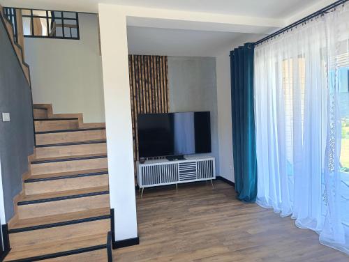 Μια τηλεόραση ή/και κέντρο ψυχαγωγίας στο Wonderland Apartamenty
