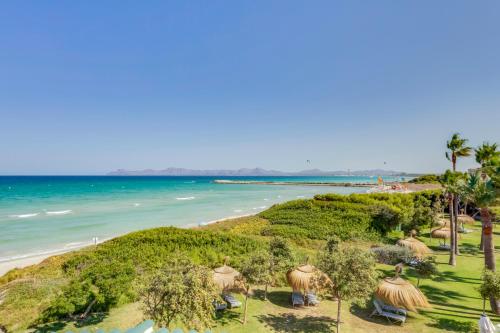 a view of the beach and the ocean at Playa Esperanza Resort Affiliated by Meliá in Playa de Muro