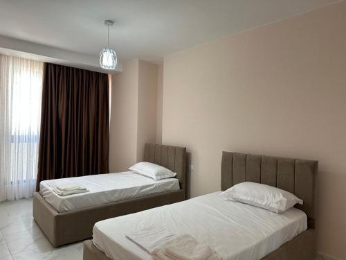 Ένα ή περισσότερα κρεβάτια σε δωμάτιο στο Adan Luxury Aparthotel