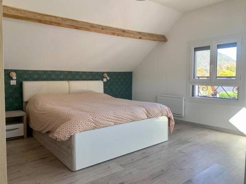 Postel nebo postele na pokoji v ubytování La cabane de Louise