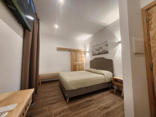 Ένα ή περισσότερα κρεβάτια σε δωμάτιο στο Residenza Tittinu