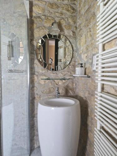 a bathroom with a sink and a mirror at Château de Courtebotte in Saint-Jean-de-Blaignac