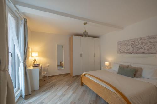 Ένα ή περισσότερα κρεβάτια σε δωμάτιο στο Cozy Flat - nel Cuore di Santa Maria - ItalyWeGo