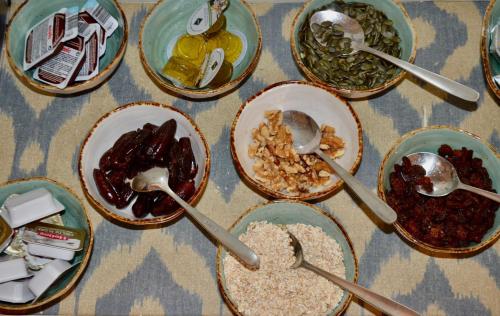 a group of bowls of food with spoons on a table at Madeinterranea Suites in Málaga