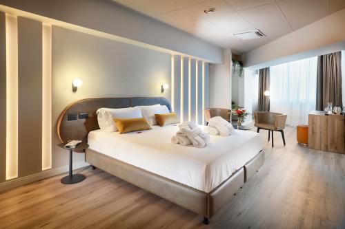 Postel nebo postele na pokoji v ubytování Tuscany Inn