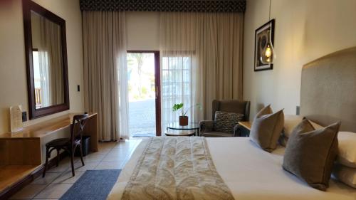 Ένα ή περισσότερα κρεβάτια σε δωμάτιο στο Shonalanga Lodge