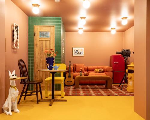a living room with a couch and a table at Private house 100sqm with bicycles Disney 30min in Tokyo