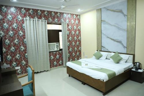 Postel nebo postele na pokoji v ubytování Hotel Saina stay Inn