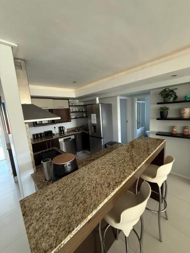 Η κουζίνα ή μικρή κουζίνα στο Seaside Rainbow Retreat At The Pearls #inverter