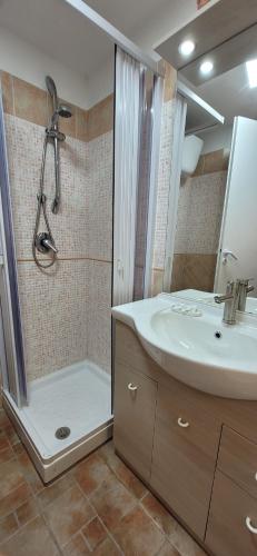 a bathroom with a shower and a sink and a shower at La Salitella in Terracina
