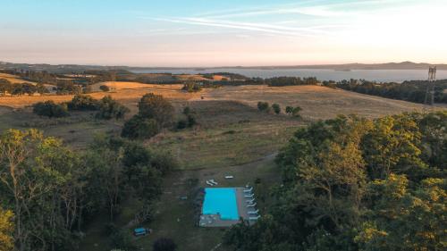 an aerial view of a farm with a pool in a field at Collina Blu in Orvieto