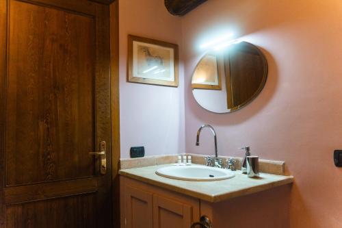 a bathroom with a sink and a mirror at Collina Blu in Orvieto
