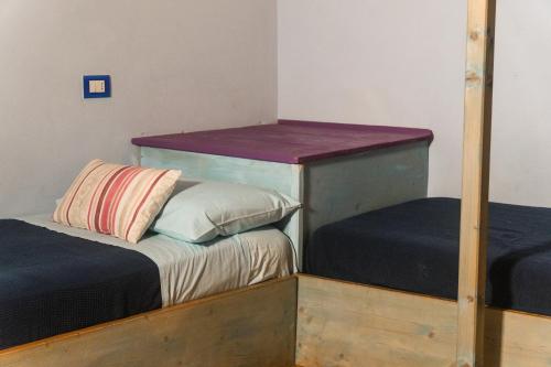 a bedroom with two bunk beds and a mirror at Collina Blu in Orvieto