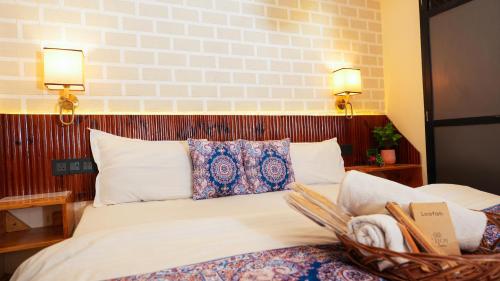 a bedroom with a bed with a basket on it at Holy River Stays in Varanasi