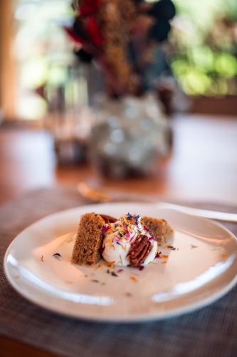 a plate with a piece of cake on a table at MAD Retreat Hotel in Nendaz