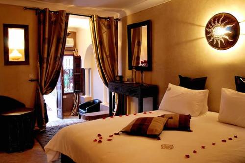 מיטה או מיטות בחדר ב-Riad D'Airain