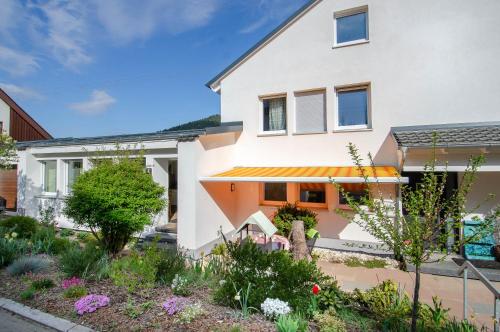 a house with a garden in front of it at Haus Sieber in Schiltach