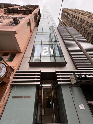 a building with a clock on the side of it at Twenty One Whitfield in Hong Kong