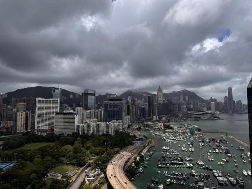 a harbor filled with lots of boats in a city at Twenty One Whitfield in Hong Kong