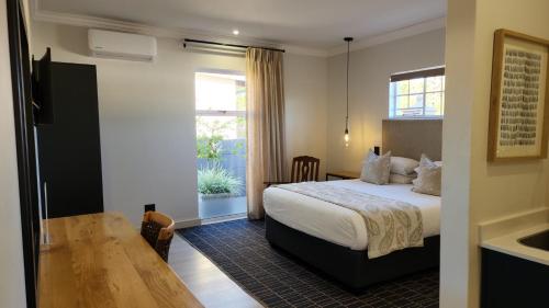 Ένα ή περισσότερα κρεβάτια σε δωμάτιο στο Shonalanga Lodge