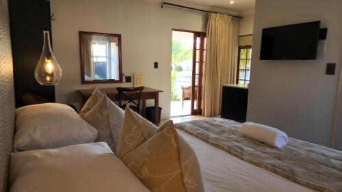 Ένα ή περισσότερα κρεβάτια σε δωμάτιο στο Shonalanga Lodge