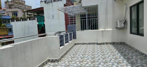 a building with a staircase leading up to a window at ABS peace home in Burhānilkantha