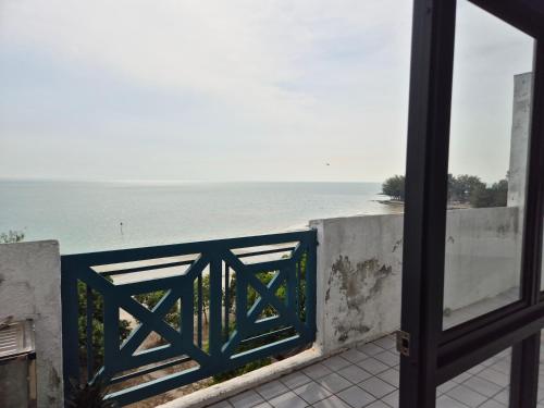 a view of the ocean from a balcony at 13pax BAYU EXECUTIVE SUITE 3R2B, SEASIDE, ROOFTOP BBQ, WATERSPORT, Pool, Wifi, 50"TV in Port Dickson