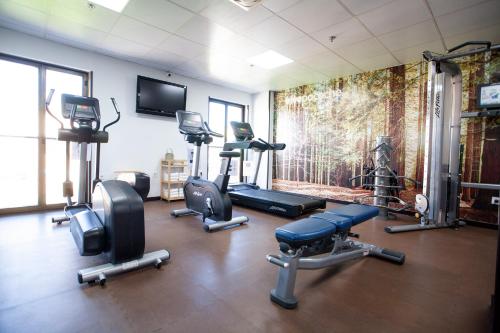 a gym with several exercise equipment in a room at Pacoche Murcia in Murcia